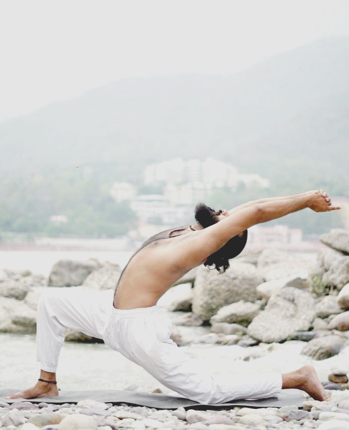 Students practising yoga at Arya Yog Peeth on the banks of the Ganga in Rishikesh